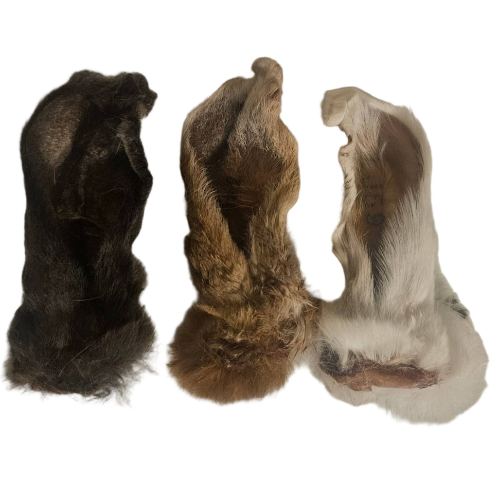 Three small animal pelt samples on a white background